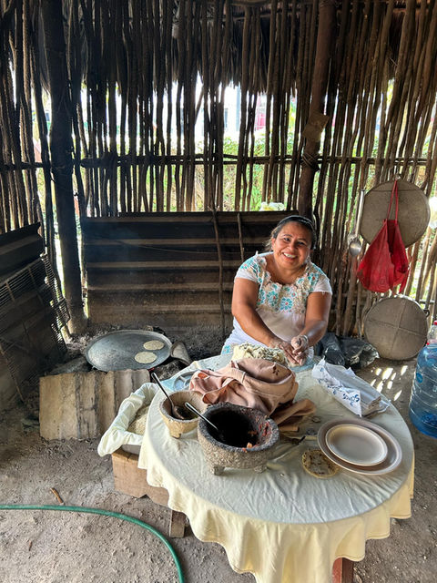 Chichen Itza where a local Mexican woman making tortillas on the guided motorcycle tour on a Harley-Davidson in Mexico