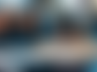 Conceptual image showing two orange figurines in focus