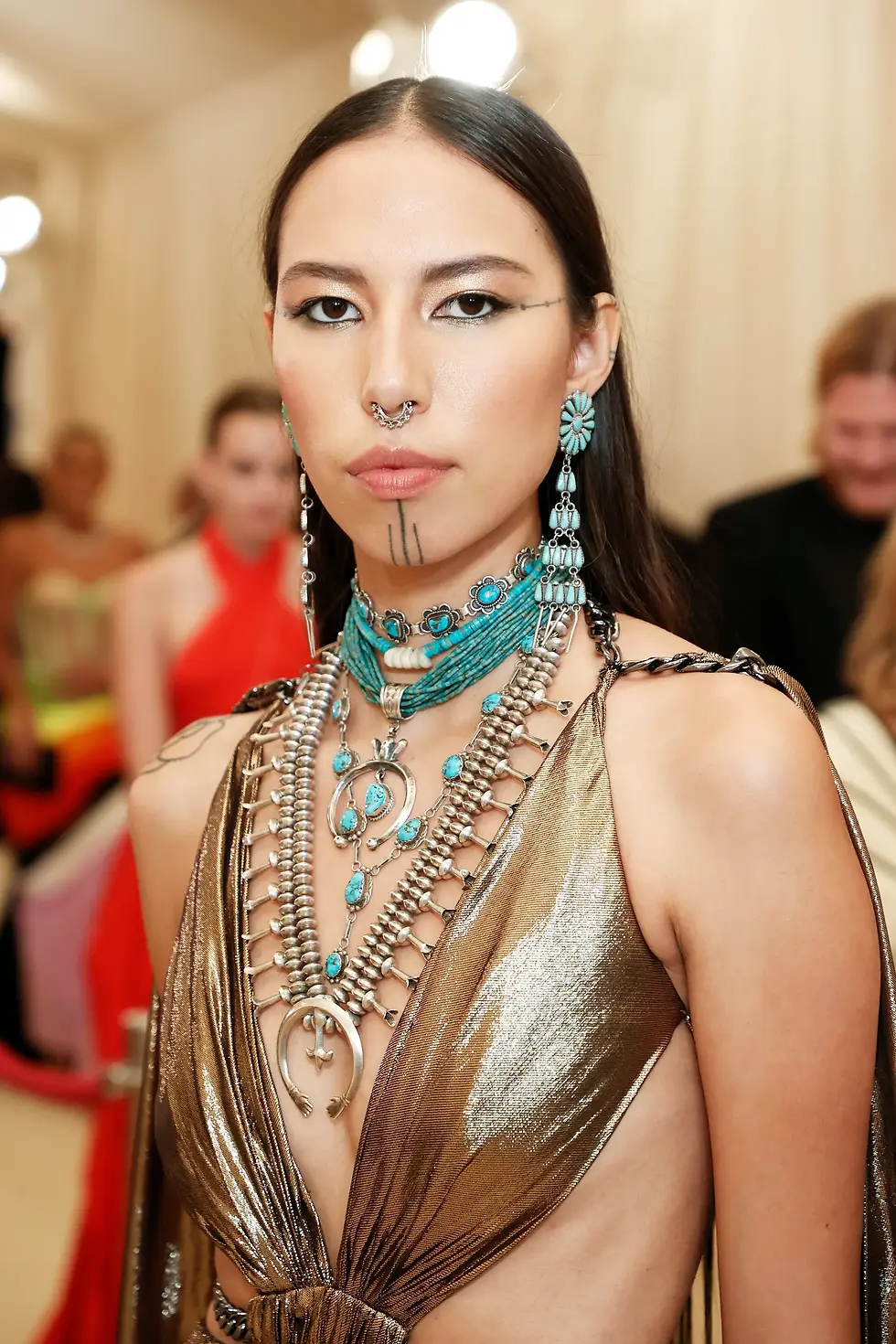 Quannah Chasinghorse at the Met Gala. The turquoise and silver she jewelry are more than accessories; they’re symbols of her Navajo identity.
