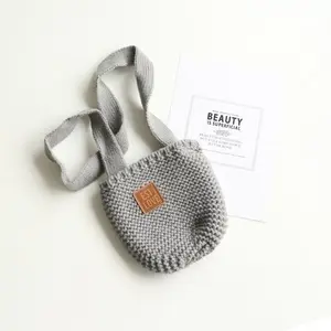 Gray knitted bag with brown label