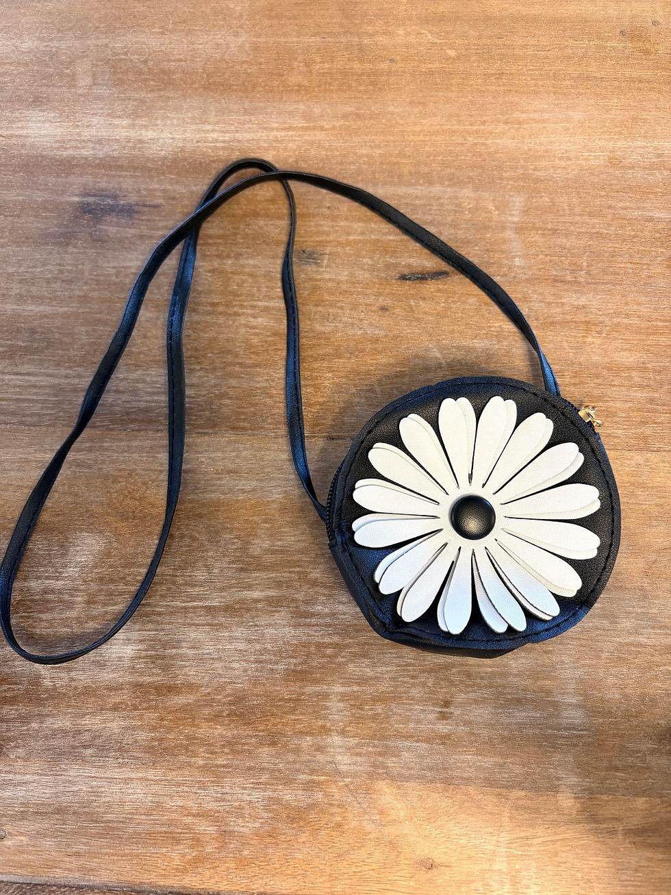 Small black round purse with white daisy design