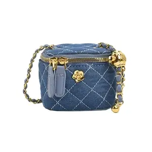 Blue quilted denim bag with gold chain