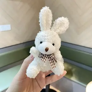 White plush rabbit with plaid bow