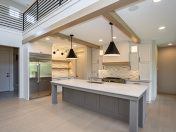 Contemporary kitchen with large island and open two-story space