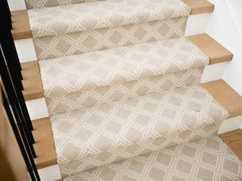 Stairs with geometric patterned carpet runner