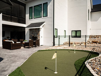 Modern house with patio and putting green