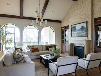 Bright living room with vaulted ceiling and wooden beams