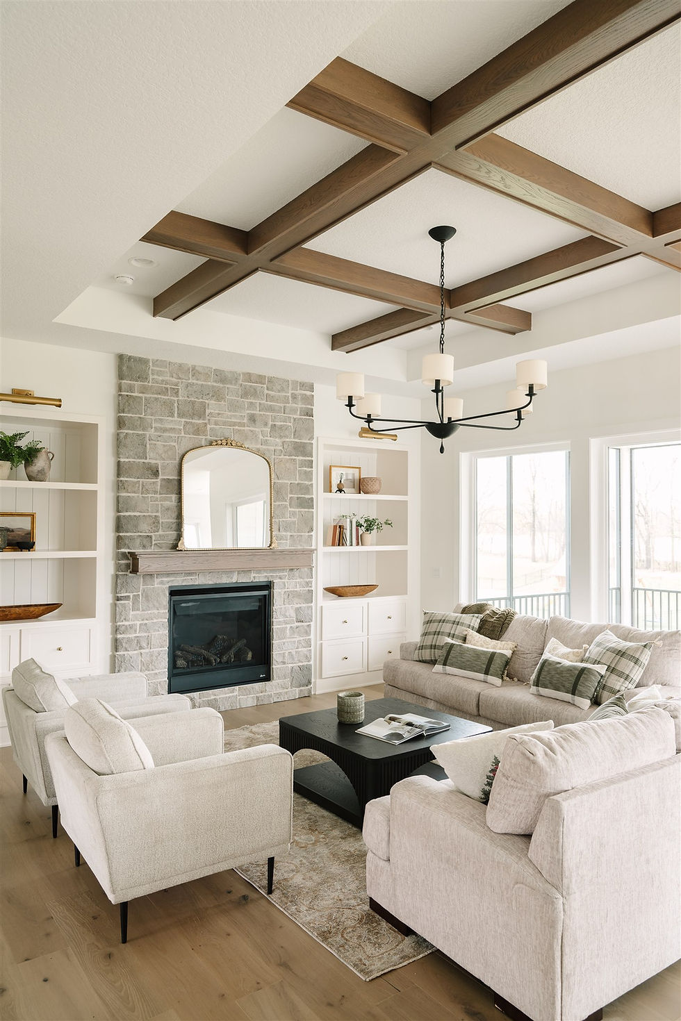 dynasty-homes-des-moines-living-room-stone-fireplace-wood-beams-coffered-ceiling.jpg.jpg