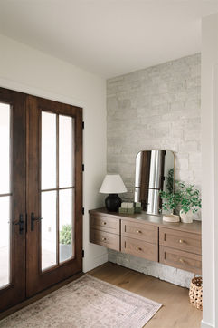 Entryway with wooden doors and floating console