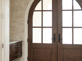 Arched double doors in an elegant entryway