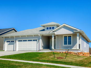 Modern light gray house with two-car garage