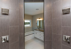 Dual Shower Heads in Master Bath with Gray Tile