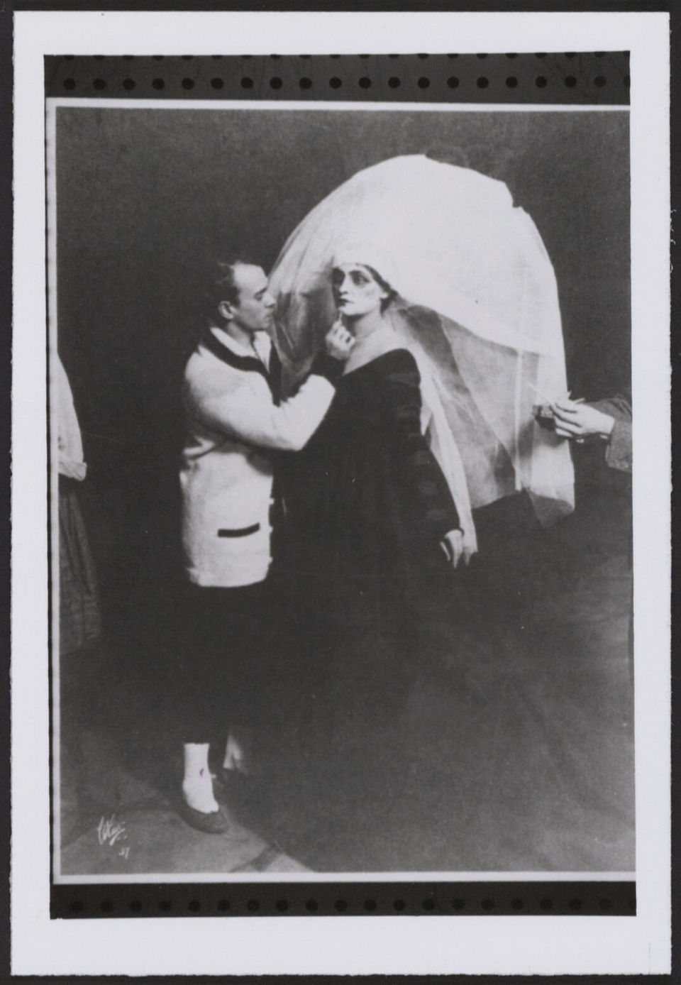 Nijinsky applying make up to a dancer in Till Eulenspiegel