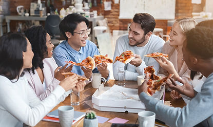 vecteezy_friendly-international-business-team-enjoying-pizza-together_52031377.jpg