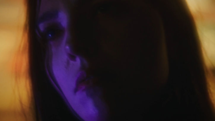 moody colorful light dreamy girl in a car 