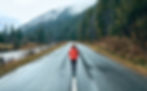 Woman standing in the street alone