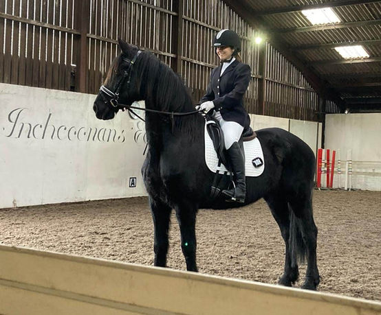 Suzanne and Envy 03 (daughter of Oscar and Matilda, mother of Barock Pinto foals Matilda (2!) and Luther of Friesians Scotland) smiling at their first dressage competition.