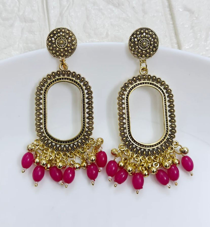 Golden Oxidized Oval Frame Earrings with Pink Beads front view