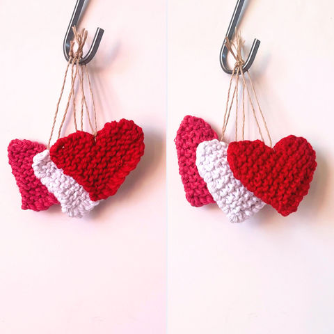 Mini hand knitted hearts, some stuffed, some single layer, in red, white and pink, hanging on hooks