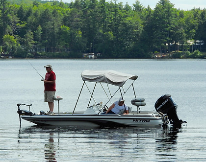 A man fishing from a boat on Kezar Lake.