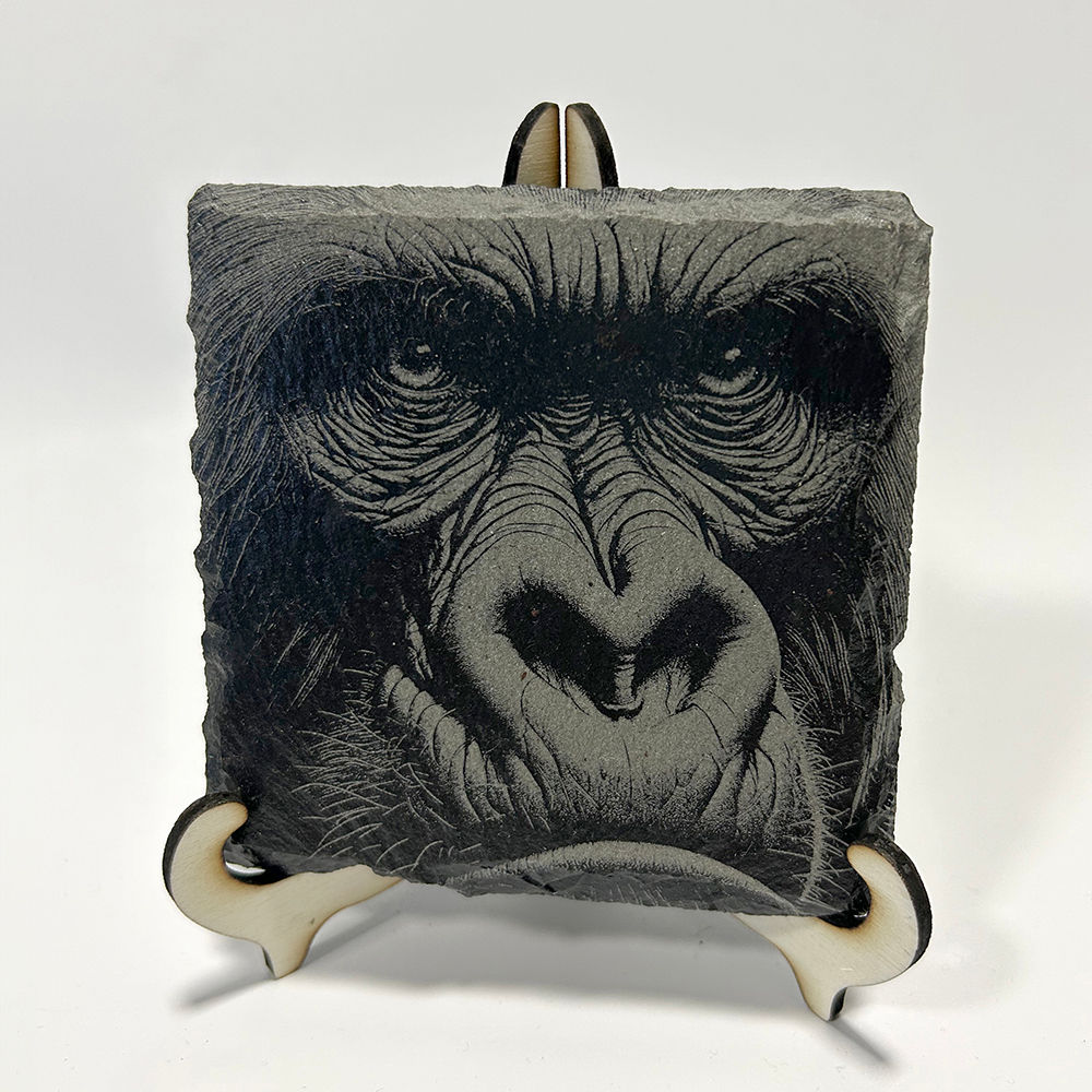 Gorilla engraved onto a piece of slate on stand