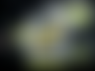 Cinematic 16:9 image of a banana frozen inside a clear ice block on a wet tabletop with a blurred background, bold “Nano Banana” title at the bottom, and a small search-style “G” badge near the top.