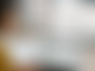 A businesswoman in a mustard suit reviewing Google Maps analytics on her laptop in a modern Sandton office. A digital reminder highlights “The Ultimate Local SEO Guide for Sandton Businesses (2025).”