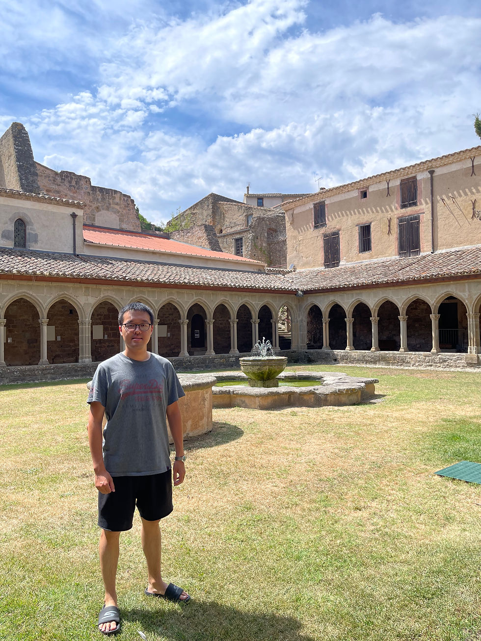 The peaceful atmosphere of the cloister contrasts with my smiling face in the foreground.