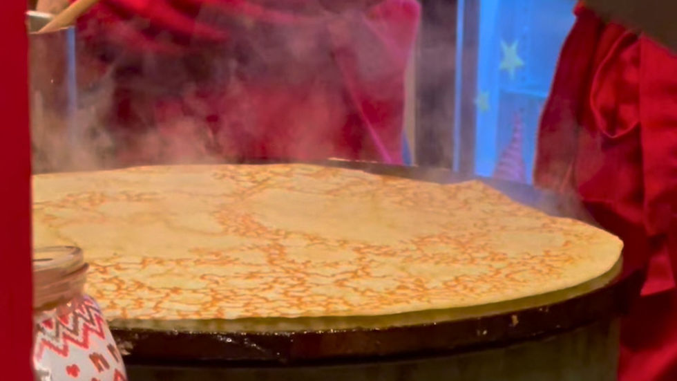 strasbourg crepe being cooked on a griddle during winter