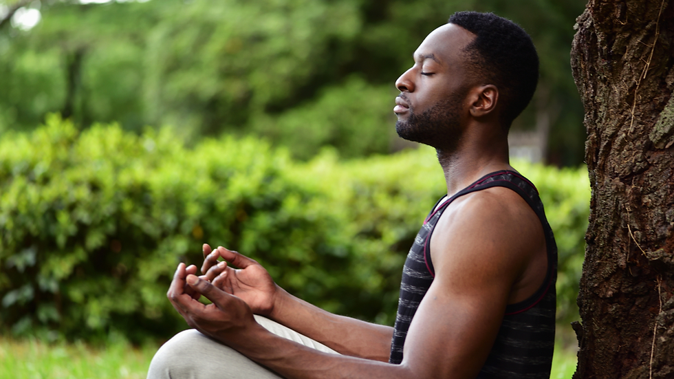 High angle view of a meditation teacher preparing a quiet indoor space with candles and cushions