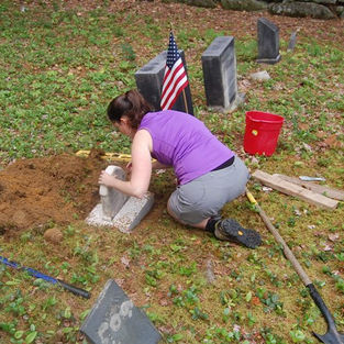 Placing stone in new base.