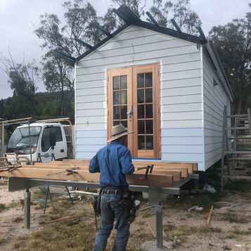 Carpenter building a timber deck attached to a modular home on the Atherton Tablelands.