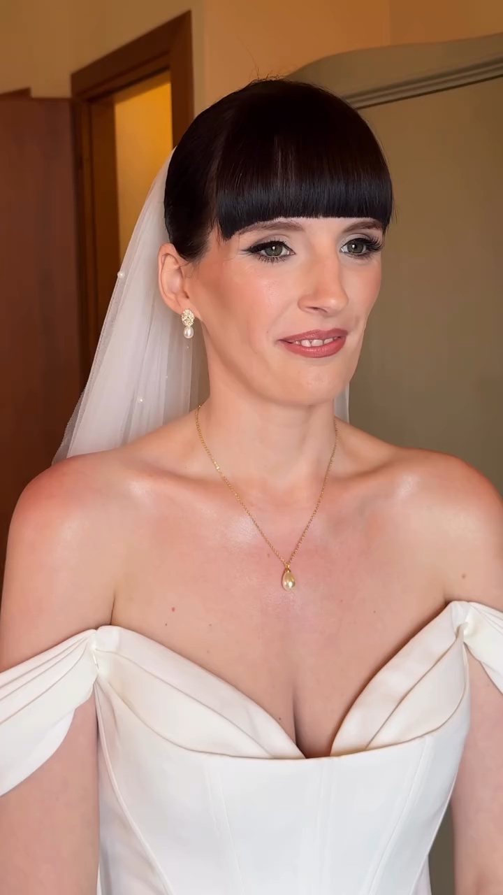 Lake Garda bride in her veil with soft glowing makeup