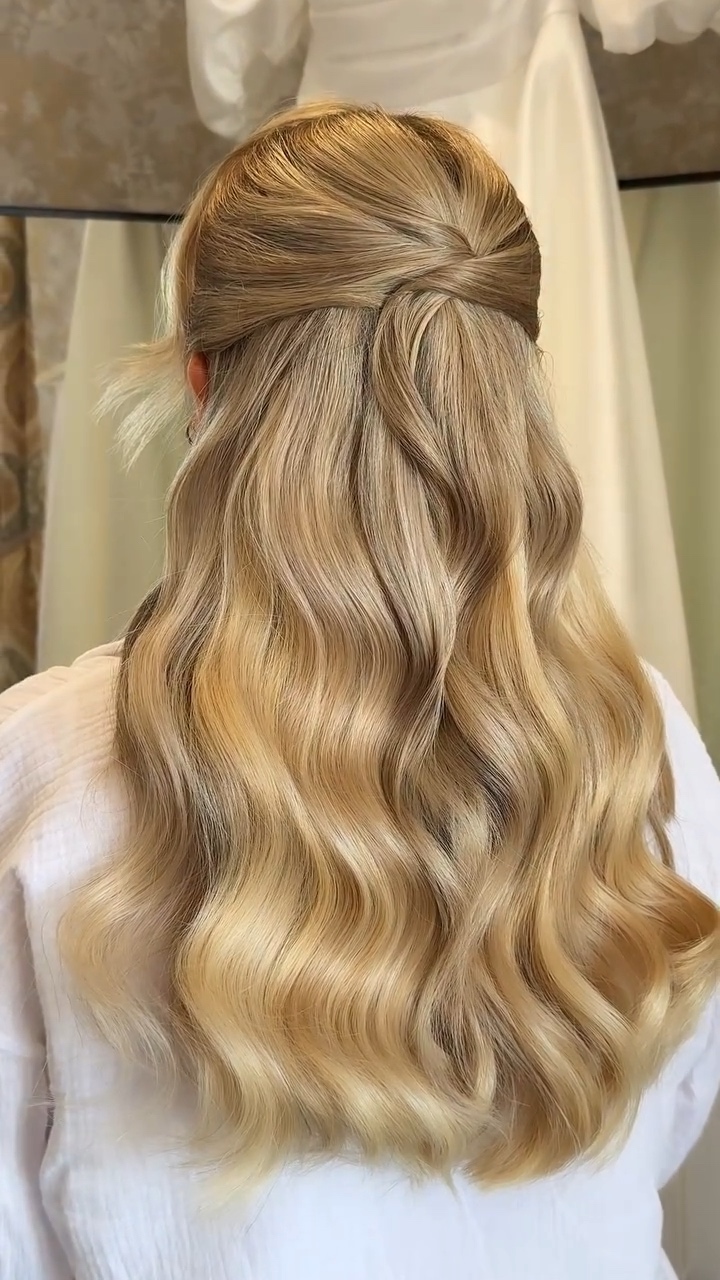 Half-up bridal hair with long blonde waves