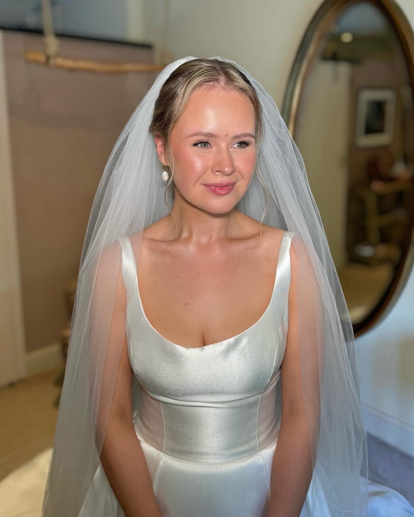 Bride in her veil and satin gown