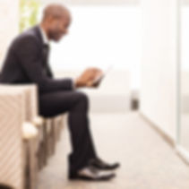 Confident businessman waiting for an int