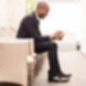 Man reading newsletter on his tablet