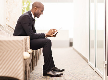 Confident businessman waiting for an int