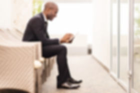 Confident businessman waiting for an int