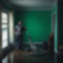 Dark green back ground and person performing a profesional water extraction from a flooded