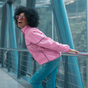 Lady in pink taking a walk in nature and enjoying life
