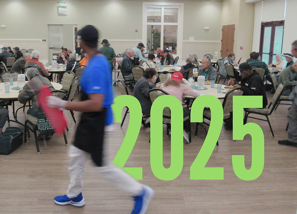An volunteer serving diners at Open Heart Kitchen's Dublin Senior Center