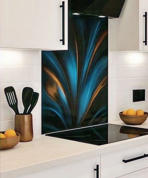 Kitchen design with white units, black door furniture, taps and artwork backsplash