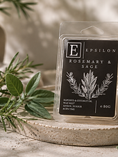 Epsilon Home Rosemary & Sage wax melts styled with fresh rosemary and sage in a warm, elegant home setting