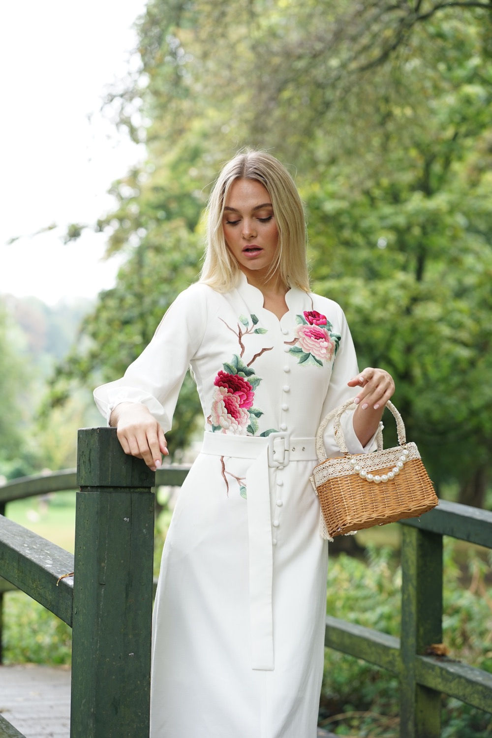 Peony embroidered in white dress .