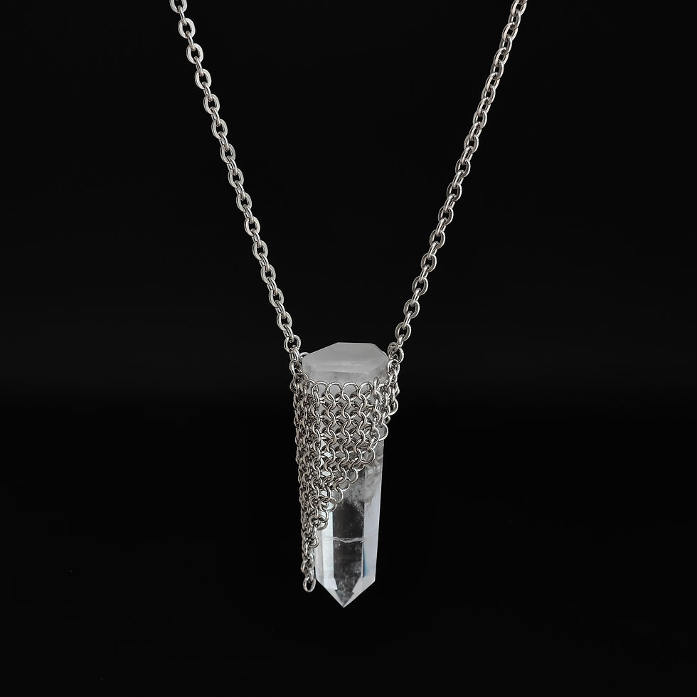 Thumbnail: The retreat necklace showcases a quartz stone perfect for meditation