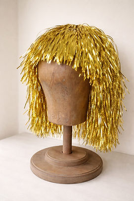 Wooden mannequin with gold tinsel wig.jpeg