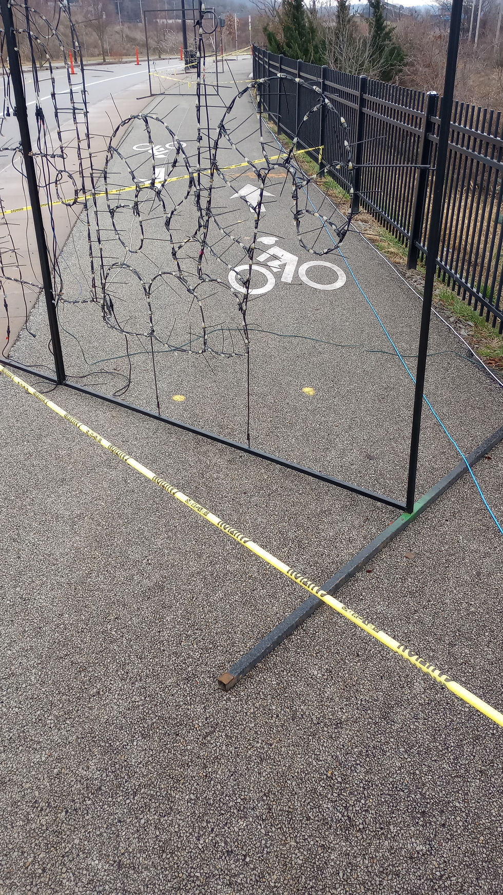 One of several places the Merry Lights display blocked the outbound sidewalk and bike lane on Blair Street from Thanksgiving to New Year’s Day. The inbound sidewalk is also closed between Eliza and Beehive streets. Photo by Juliet Martinez