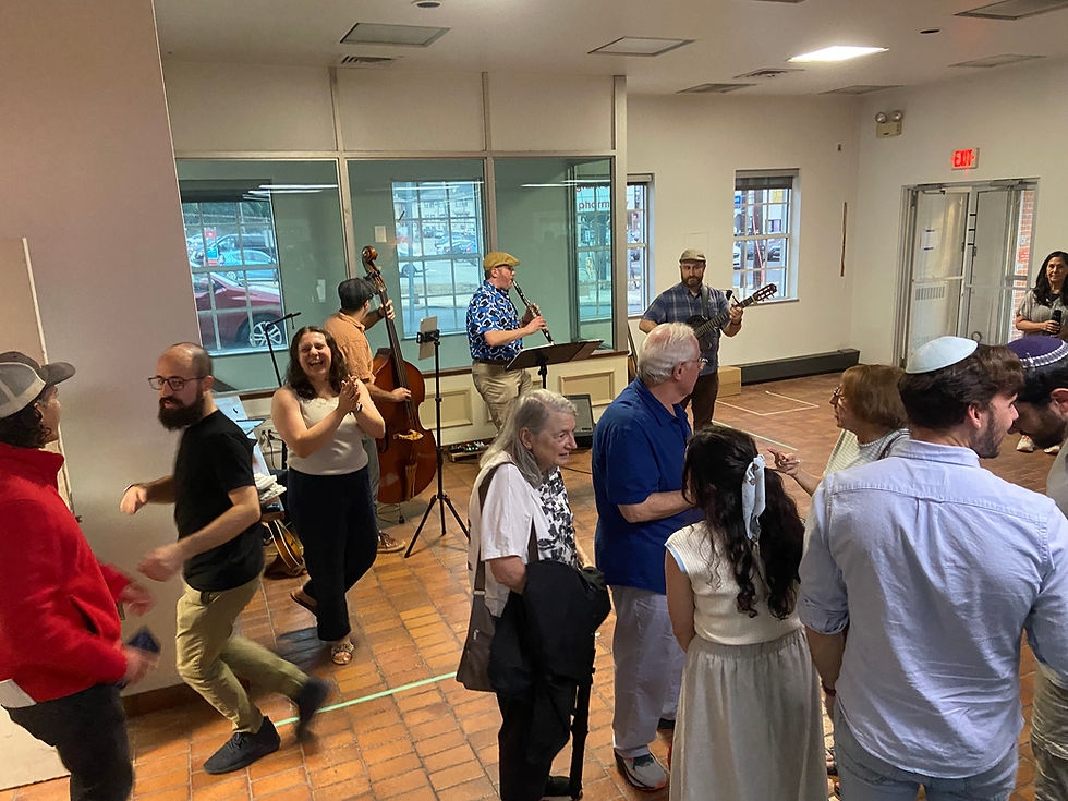 Supporters and guests dance to the klezmer band Veverke at the Aug. 12 kickoff event for Shoresh at 4300 Murray Ave. in Greenfield. Photo by Mark Goodman