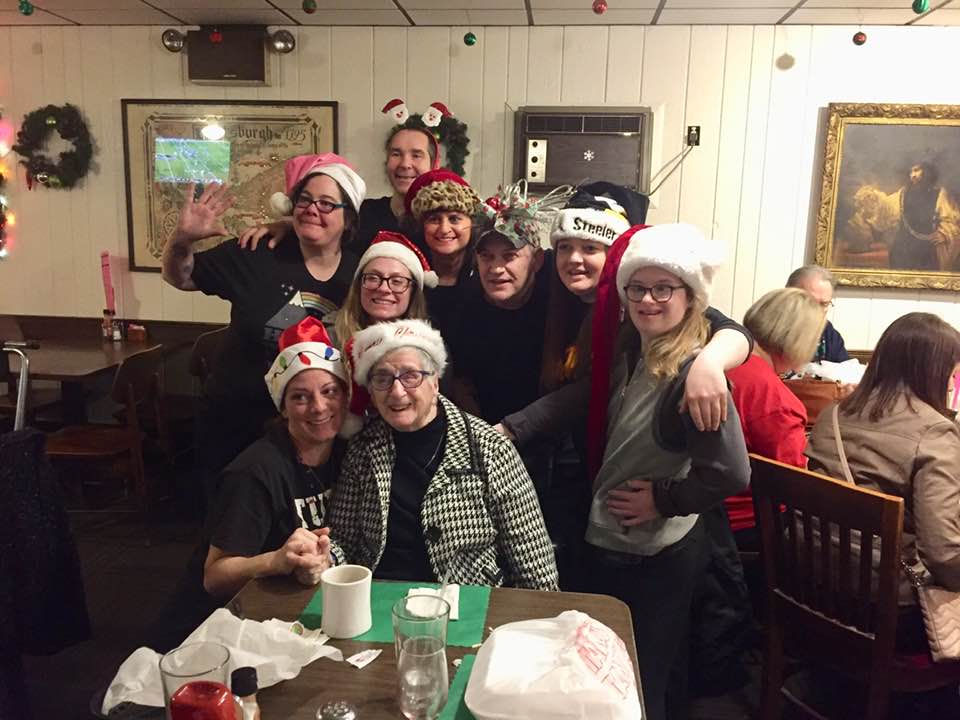 A group of people wearing Santa hats. 